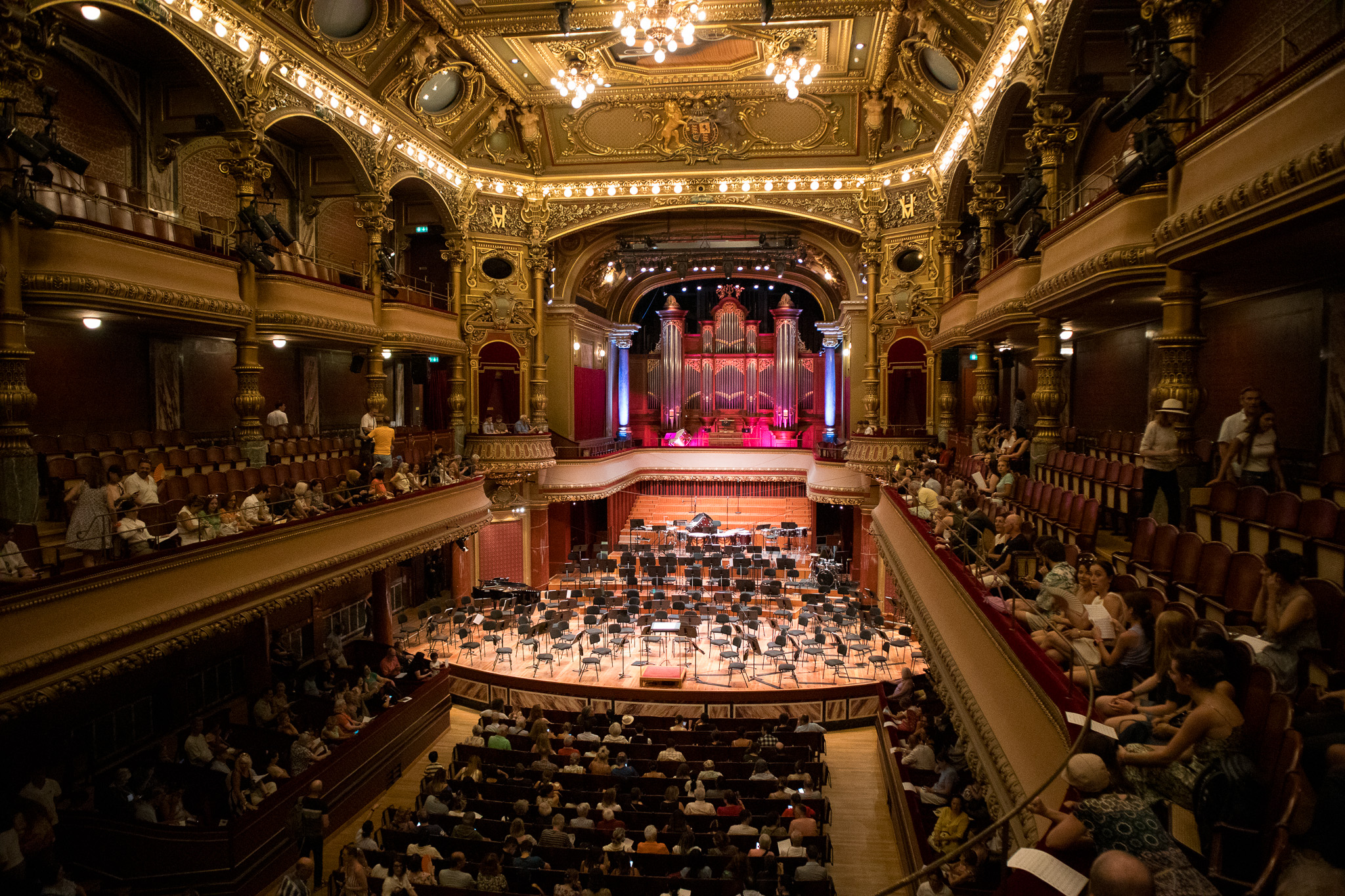 Audience gathering in the gilded Victoria Hall in Geneva before a concert